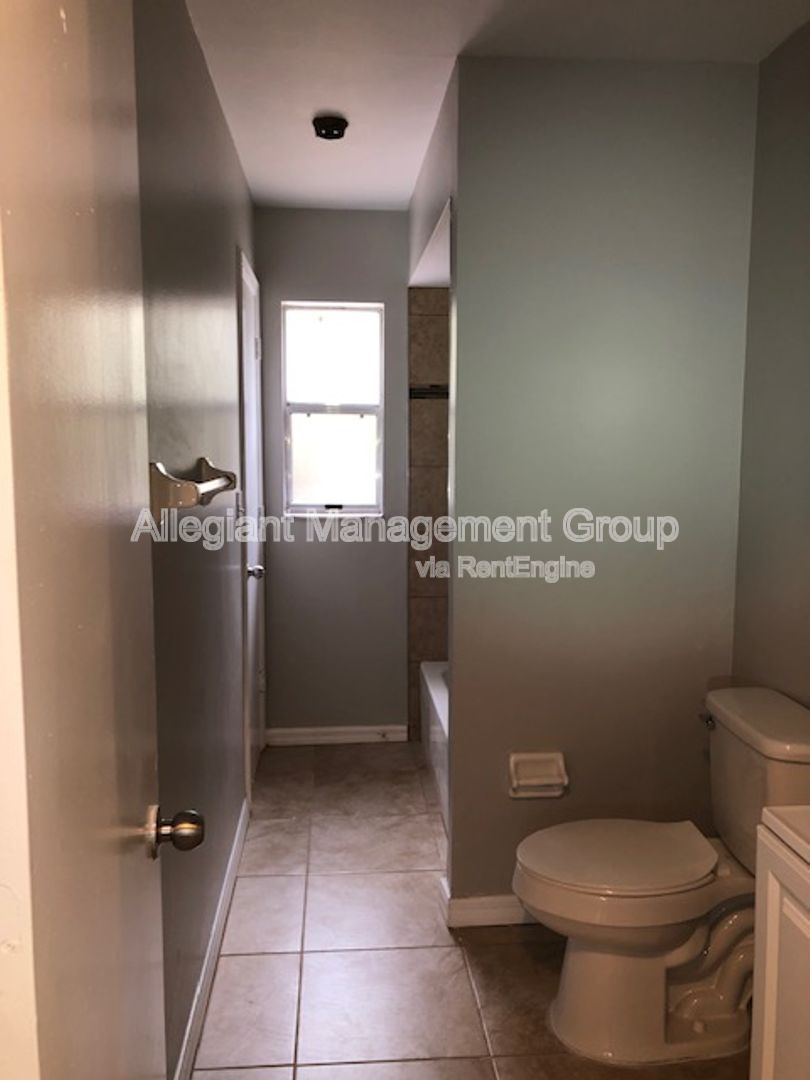 Spacious 3/2 Home In Poinciana With 2 Car garage & Screened Porch For Rent! property image