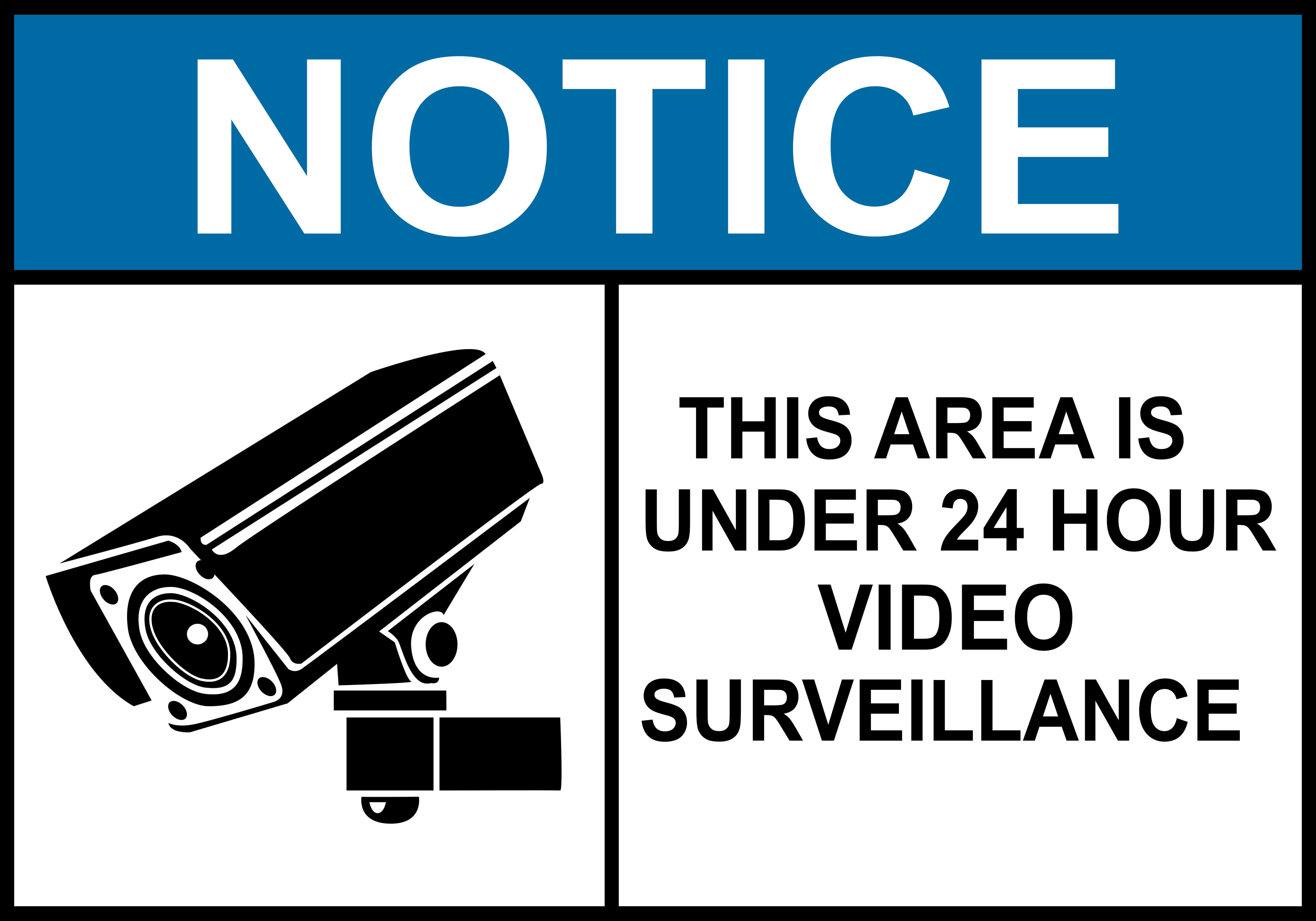 Warning sign reading ‘Notice: This area is under 24-hour video surveillance’ next to an icon of a security camera. Used to indicate surveillance presence in rental properties.