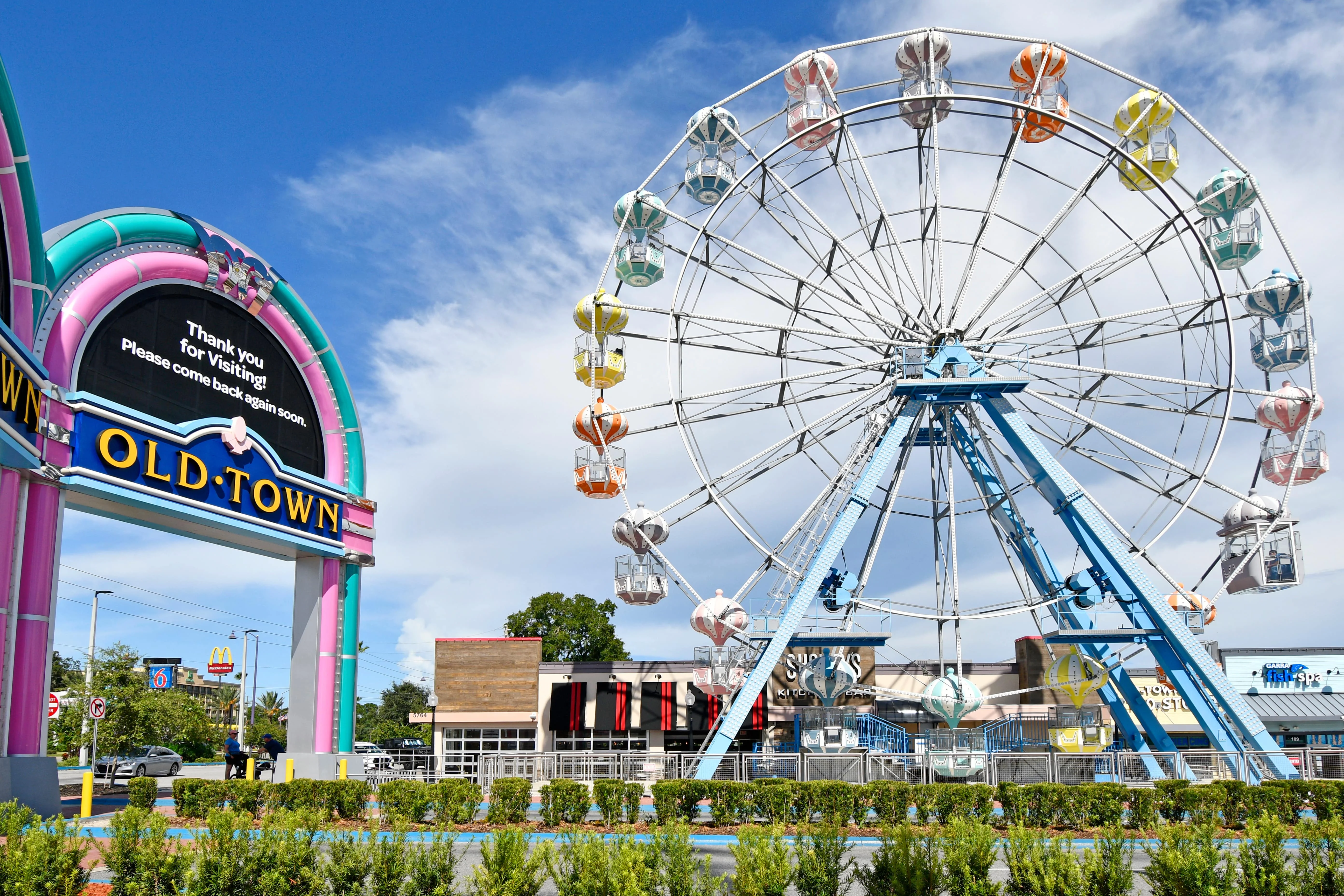 Colorful Ferris wheel at Old Town Kissimmee, illustrating lifestyle attractions near Orlando rental properties.