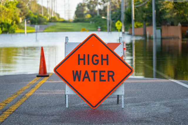 Flooded residential street in Florida with high water.