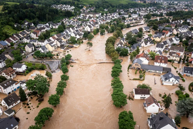 Aerial view of Florida neighborhood under floodwaters, highlighting risks covered by the new Rental Flood Disclosure Law HB 1015 – Allegiant Management Group