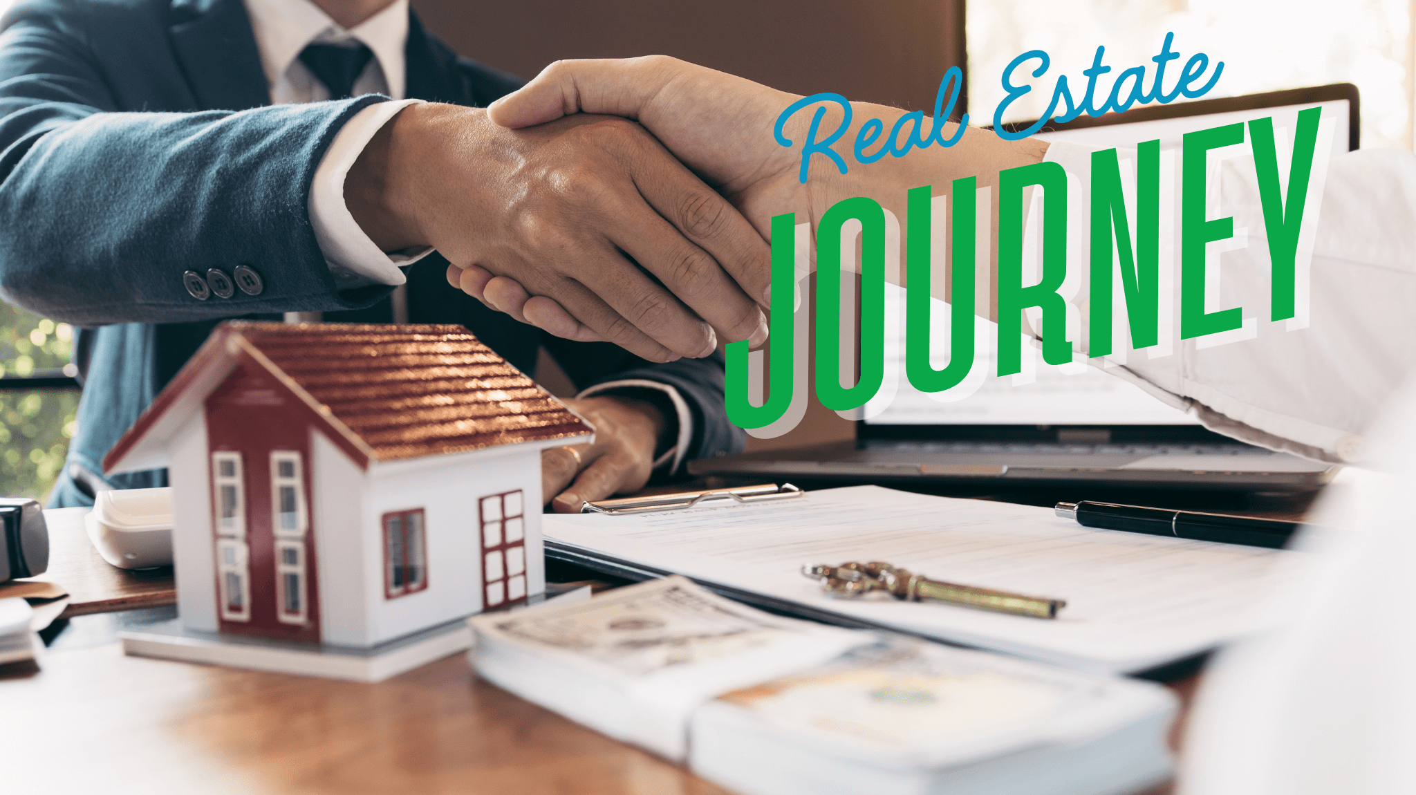 Close-up of a handshake between business professionals with a miniature house, money, and paperwork on the table—representing the start of a real estate investment journey.
